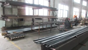 a metal tubing cutting machine at SUN-Carts factory slicing steel sections for electric golf cart chassis frame production