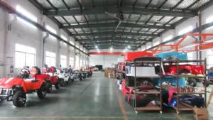 the final assembly shop at SUN-Carts factory where workers build electric golf carts on a moving production line
